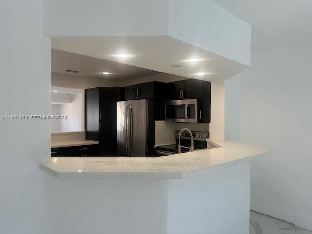 2220 Southwest 67th Way Miramar, FL 33023 - Photo 4 of 13 a kitchen with stainless steel appliances a refrigerator and a sink