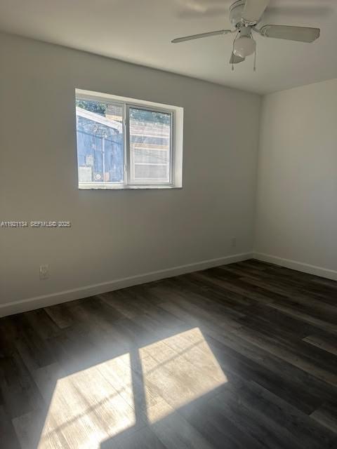 2220 Southwest 67th Way Miramar, FL 33023 - Photo 10 of 13 an empty room with wooden floor and windows