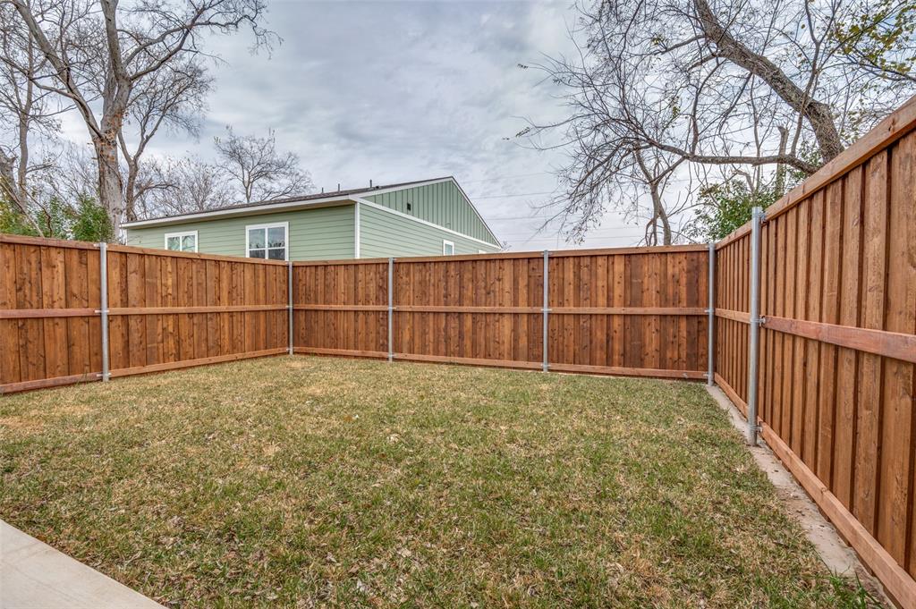 420 Sparks Street Dallas, TX 75203 - Photo 12 of 12 a view of backyard and wooden fence