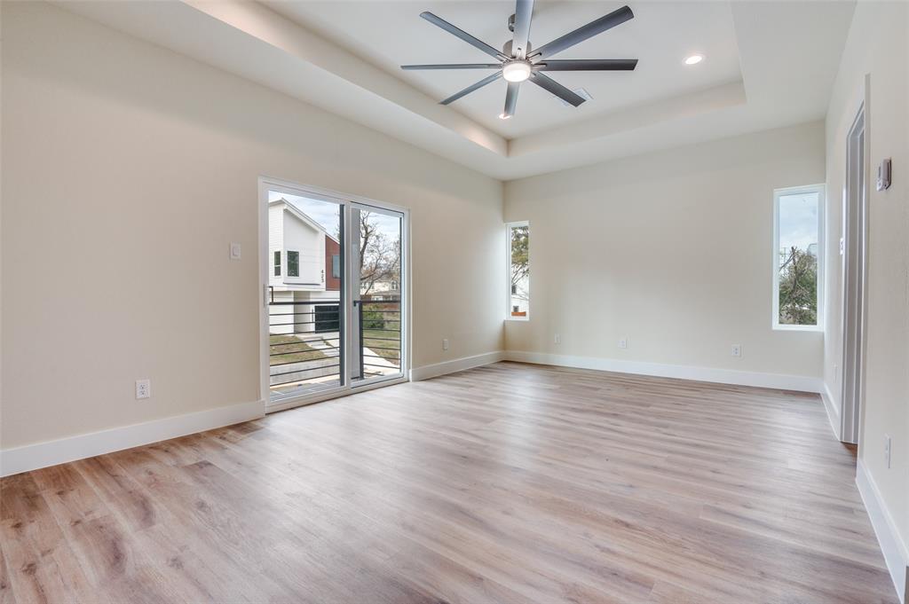 420 Sparks Street Dallas, TX 75203 - Photo 5 of 12 an empty room with wooden floor and windows