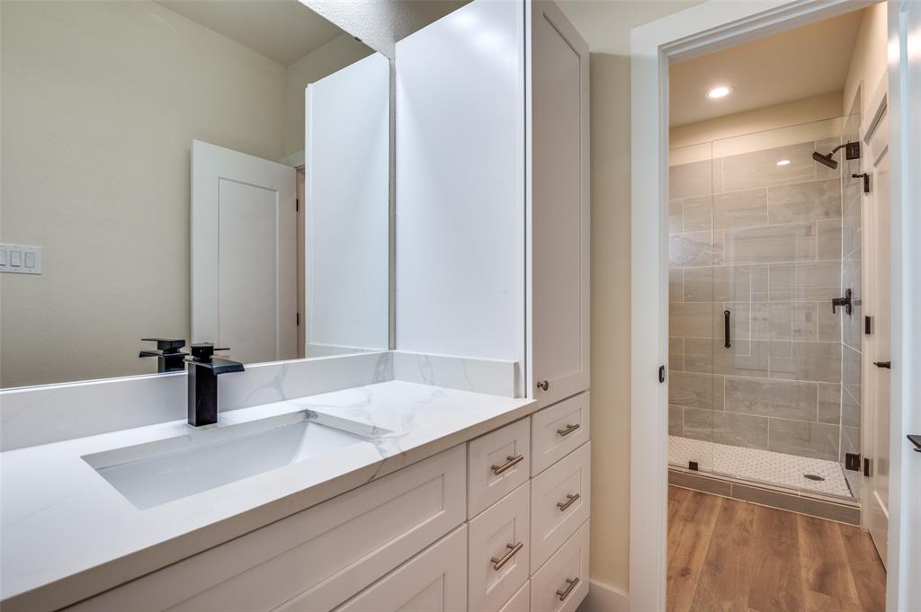 420 Sparks Street Dallas, TX 75203 - Photo 9 of 12 a bathroom with a sink and a mirror