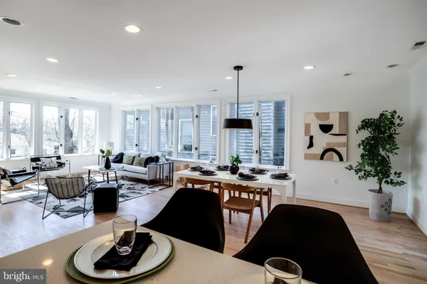 a room with lots of furniture and windows
