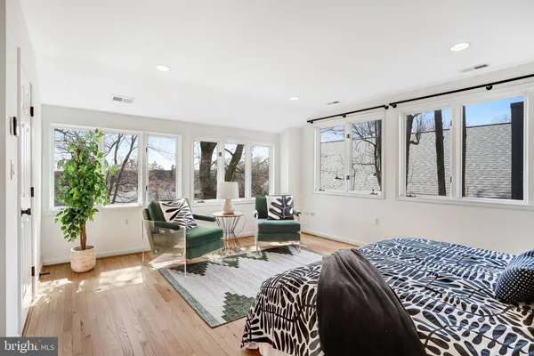 a living room with a couch and a rug
