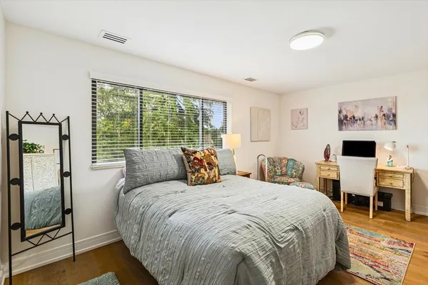 a bed room with a bed and a tv