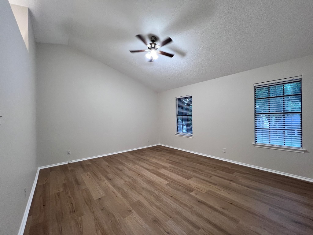 1518 White Oak Loop Round Rock, TX 78681 - Photo 10 of 17 wooden floor in an empty room with a window