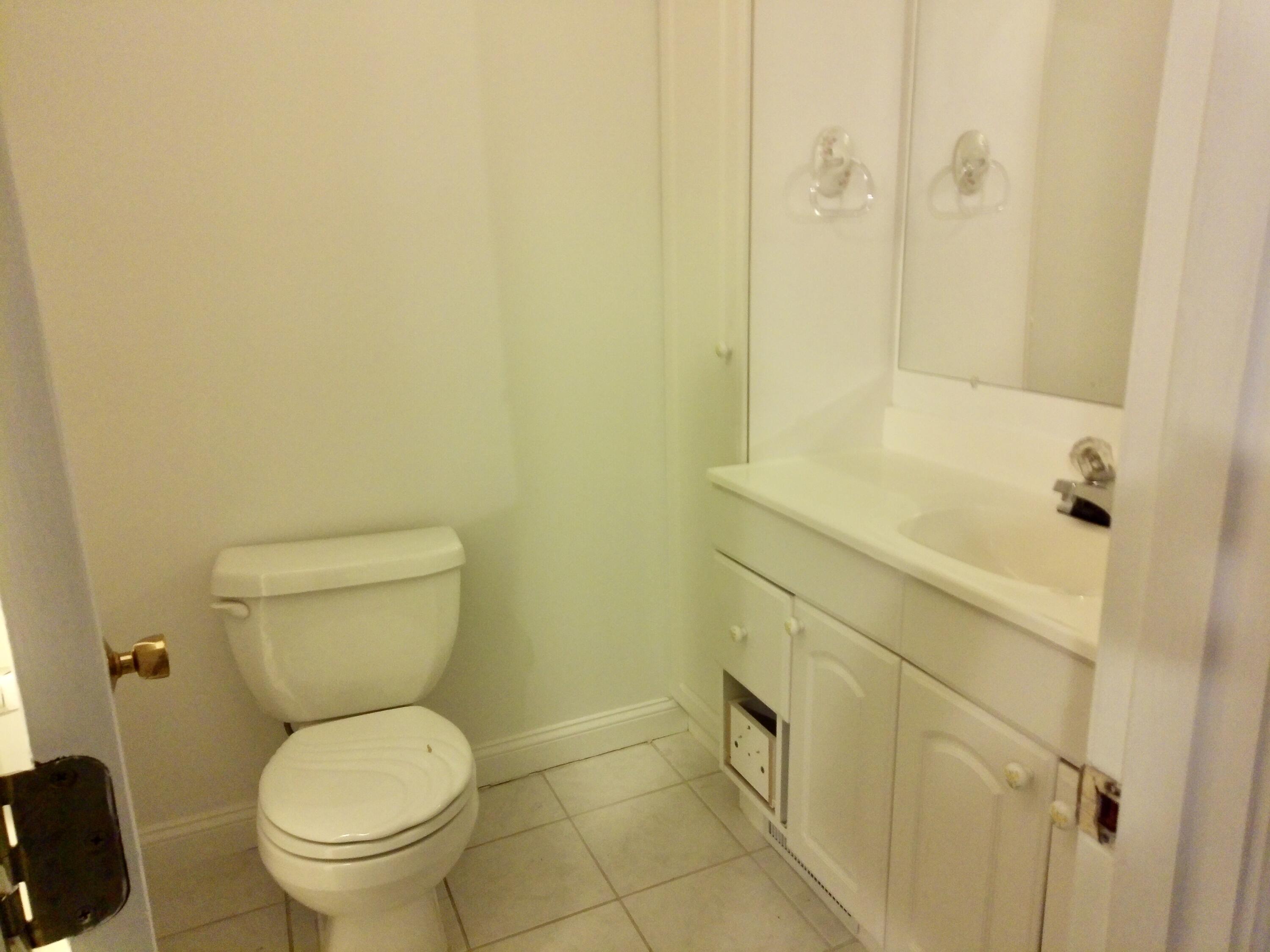 300 Buck Island Road, Unit 21B West Yarmouth, MA 02673 - Photo 13 of 14 a bathroom with a toilet and a sink