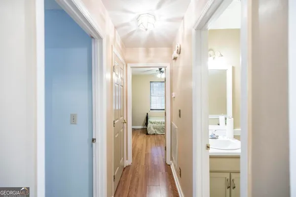 a view of a bathroom from a hallway