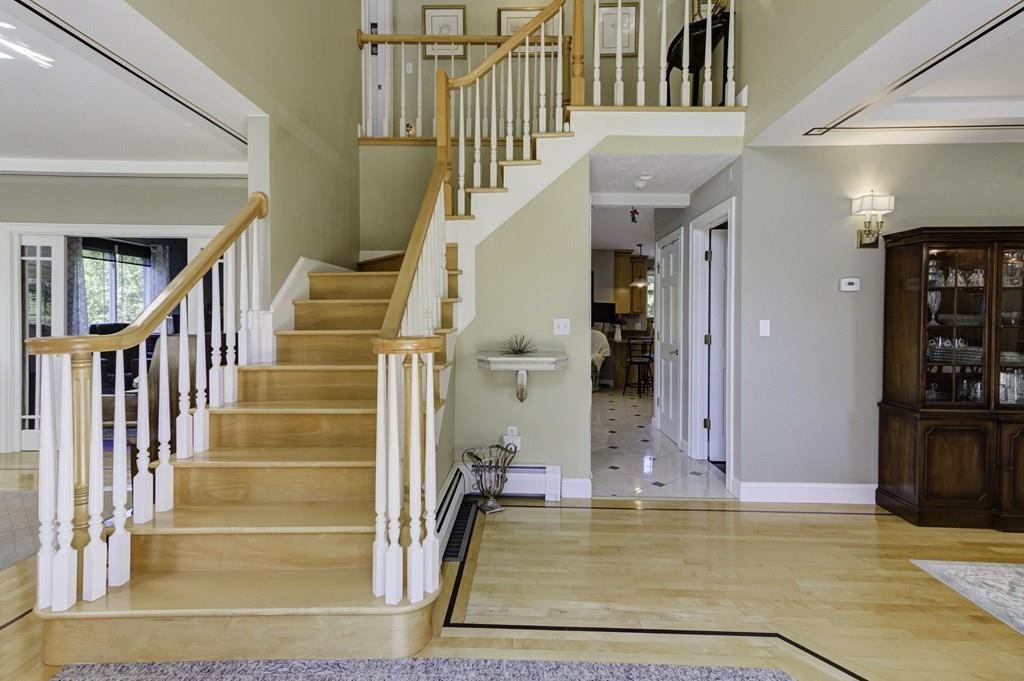 105 Merriam Road Grafton, MA 01519 - Photo 3 of 42 a view of entryway and hall with wooden floor and a livingroom view