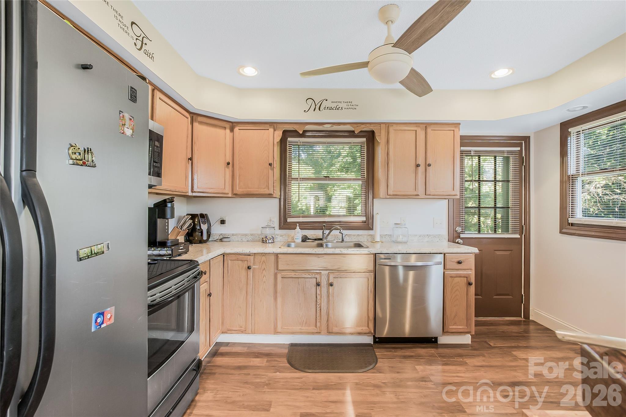 463 Winfree Road Wadesboro, NC 28170 - Photo 13 of 19 a kitchen with stainless steel appliances granite countertop a stove a sink and a refrigerator
