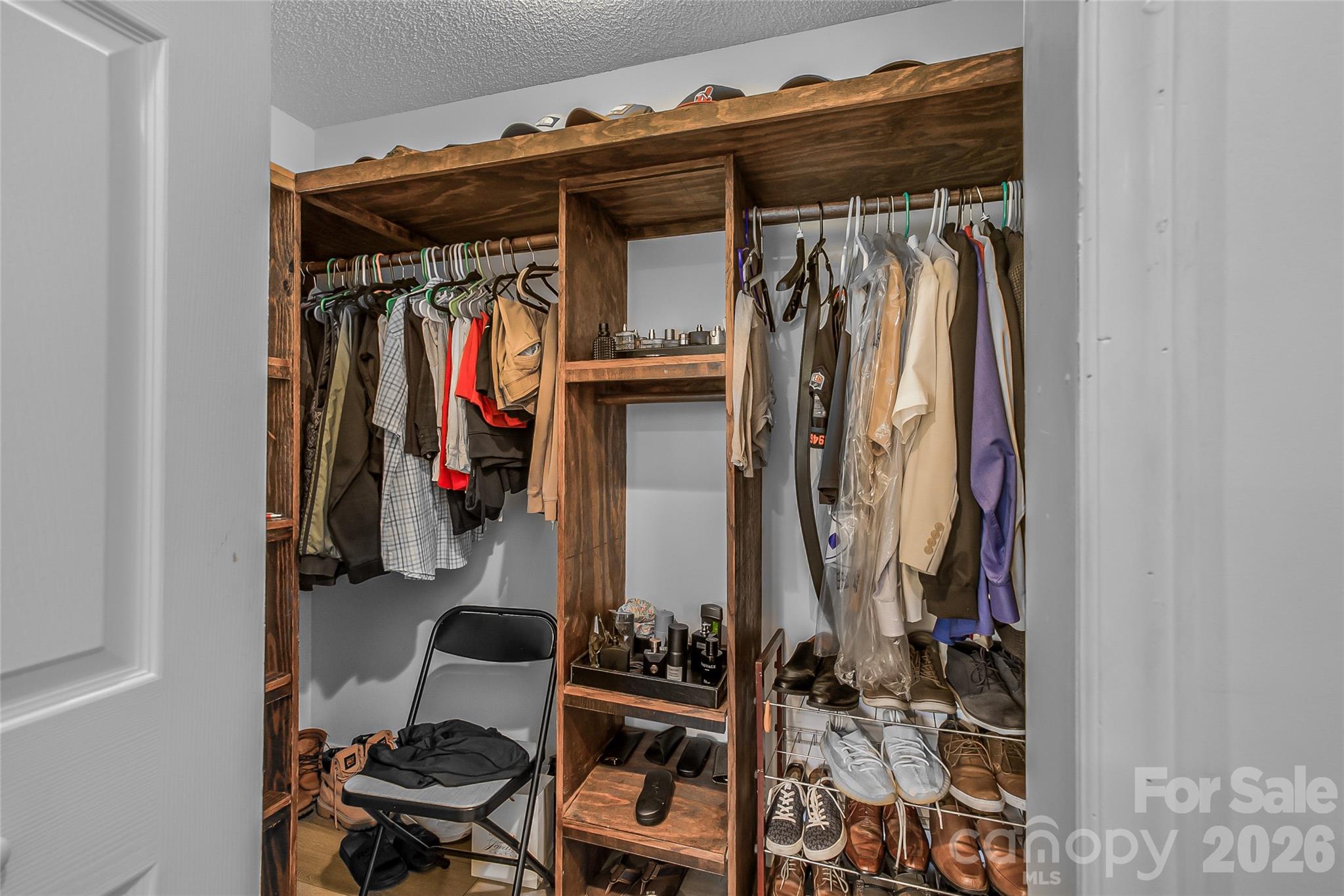 463 Winfree Road Wadesboro, NC 28170 - Photo 5 of 19 a view of walk in closet with clothes and shoes