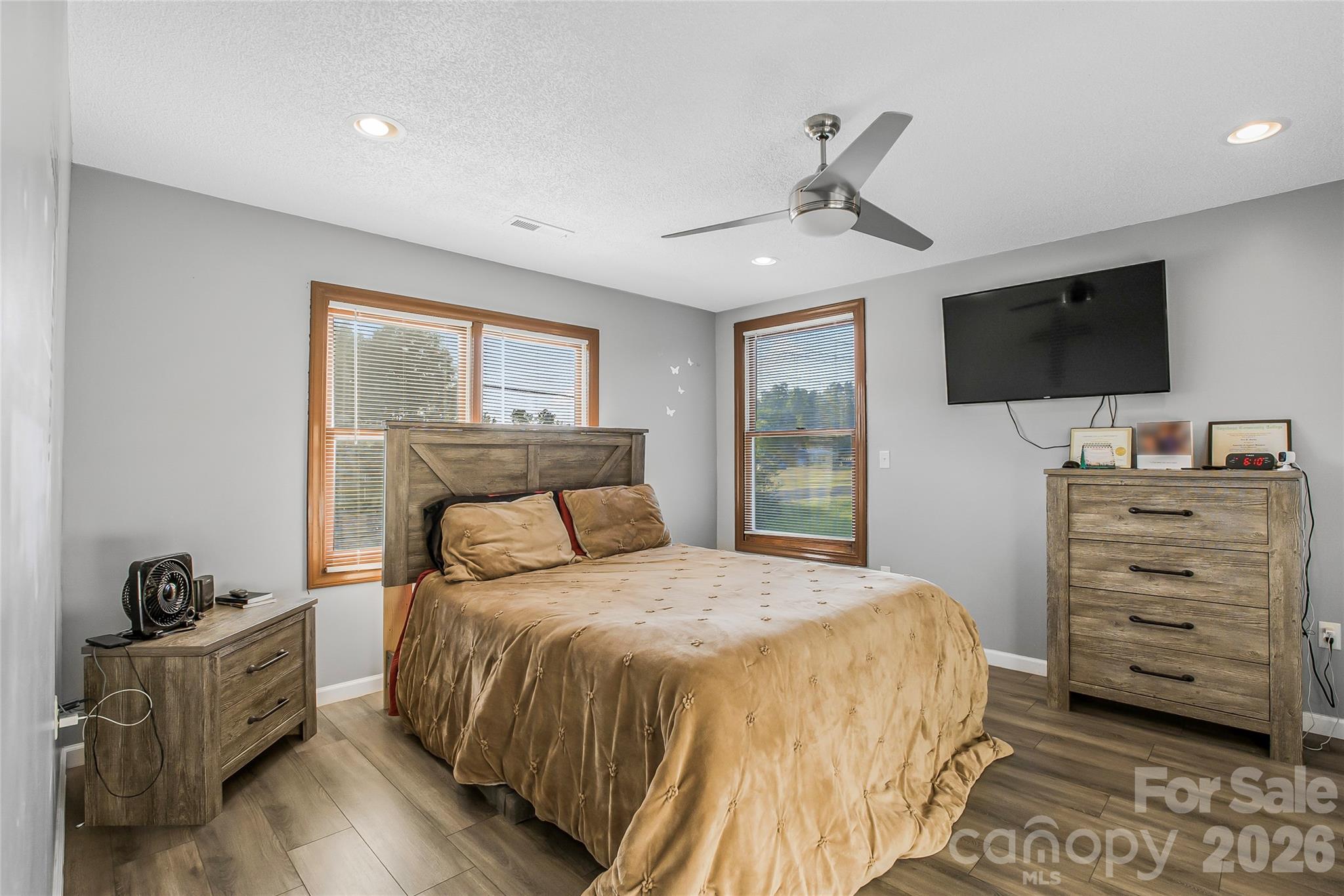 463 Winfree Road Wadesboro, NC 28170 - Photo 8 of 19 a bedroom with a bed and a flat screen tv