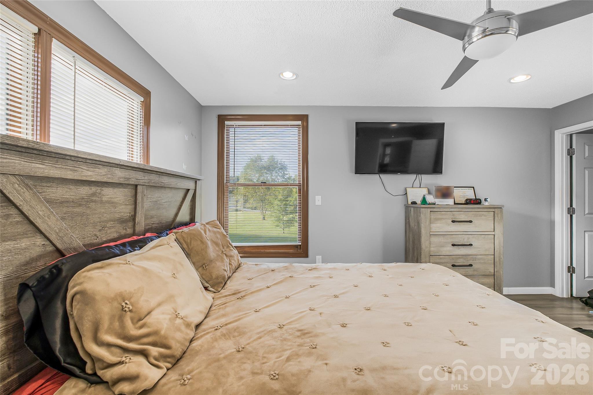 463 Winfree Road Wadesboro, NC 28170 - Photo 9 of 19 a bedroom with a bed and flat screen tv