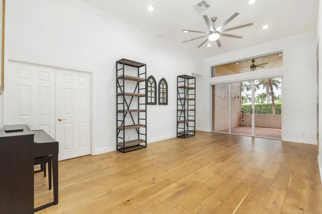 a view of livingroom with hardwood floor and a ceiling fan