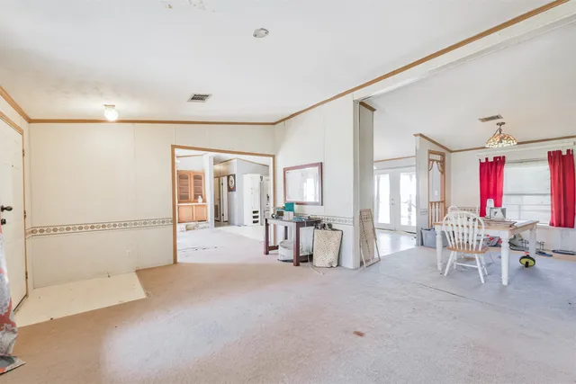 a view of a livingroom with furniture and windows
