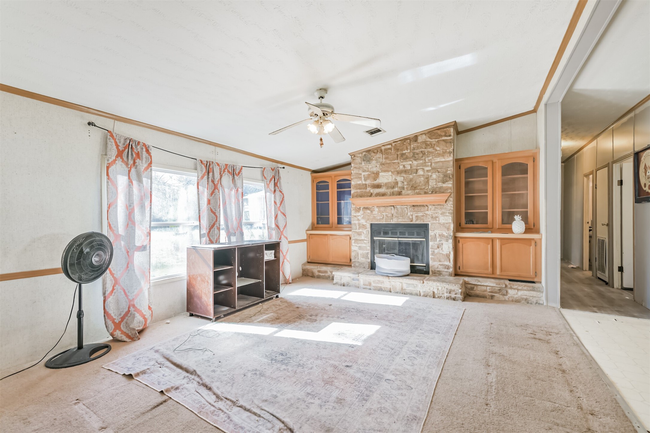 18 County Road 2236 Cleveland, TX 77327 - Photo 12 of 28 a living room with furniture and a fireplace