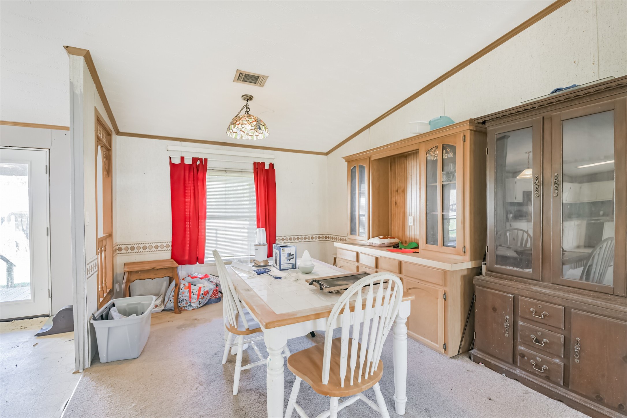 18 County Road 2236 Cleveland, TX 77327 - Photo 17 of 28 a dining room with furniture and window