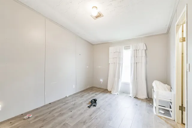 a view of livingroom with hardwood floor and a window