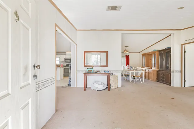 a living room with furniture and a table