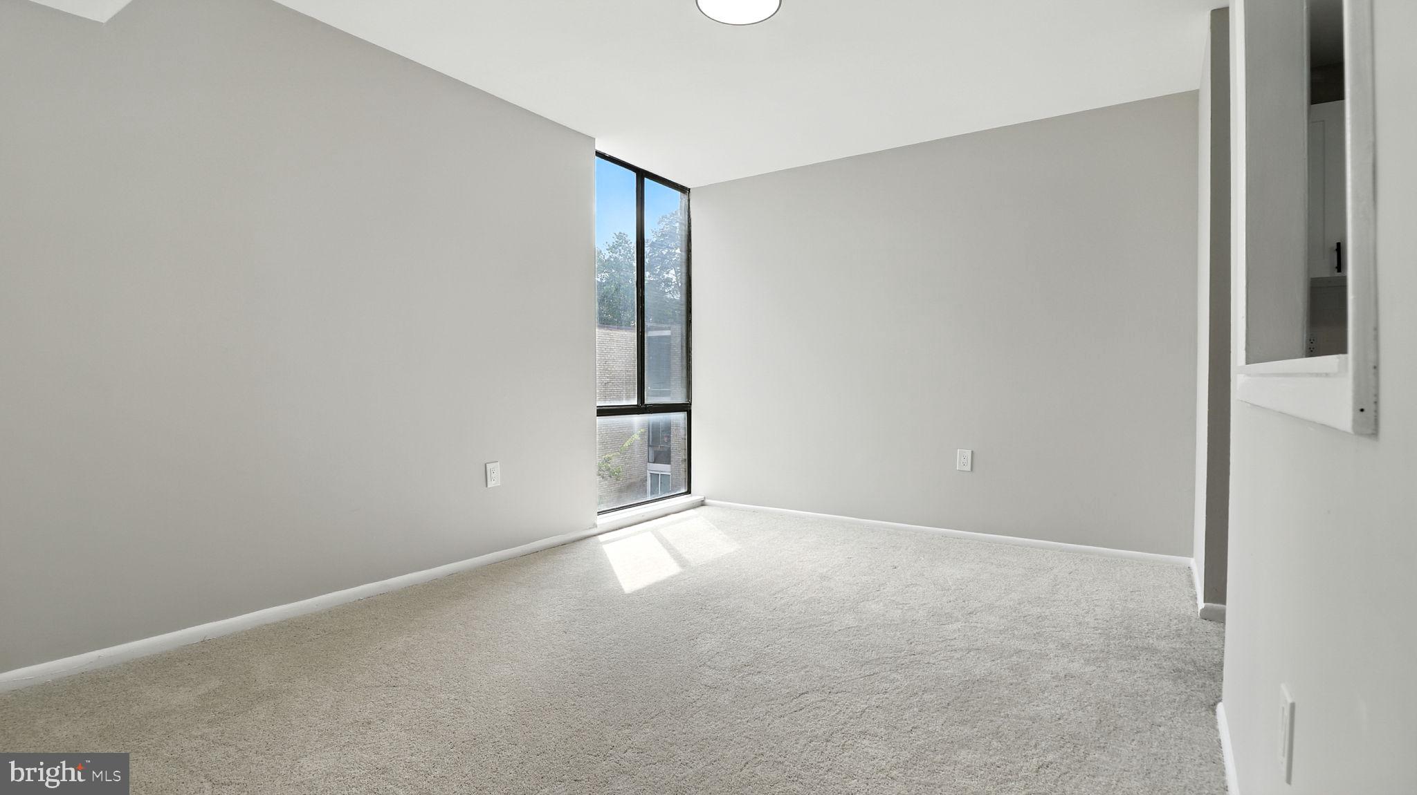 8693 Greenbelt Road, Unit 202 Greenbelt, MD 20770 - Photo 18 of 40 a view of an empty room