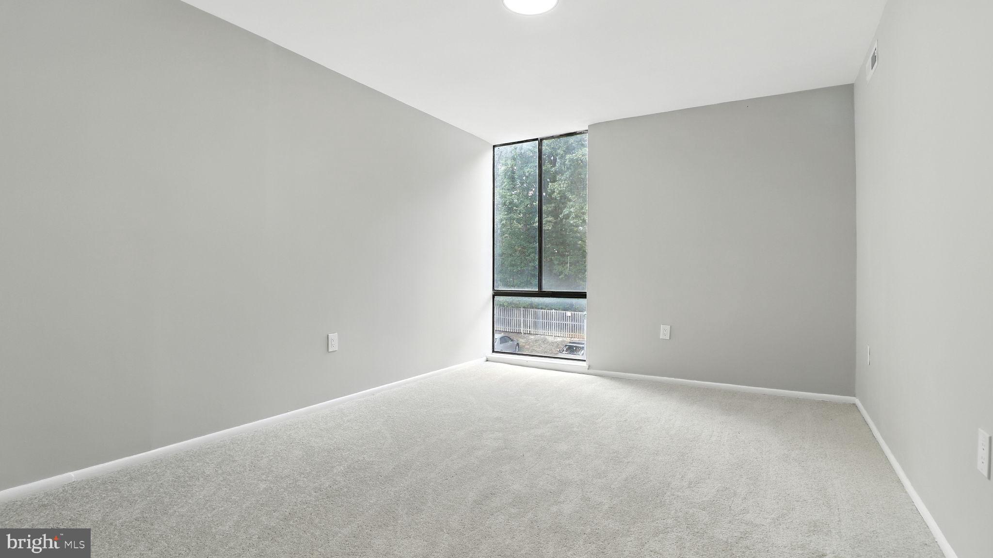 8693 Greenbelt Road, Unit 202 Greenbelt, MD 20770 - Photo 30 of 40 a view of an empty room with a window
