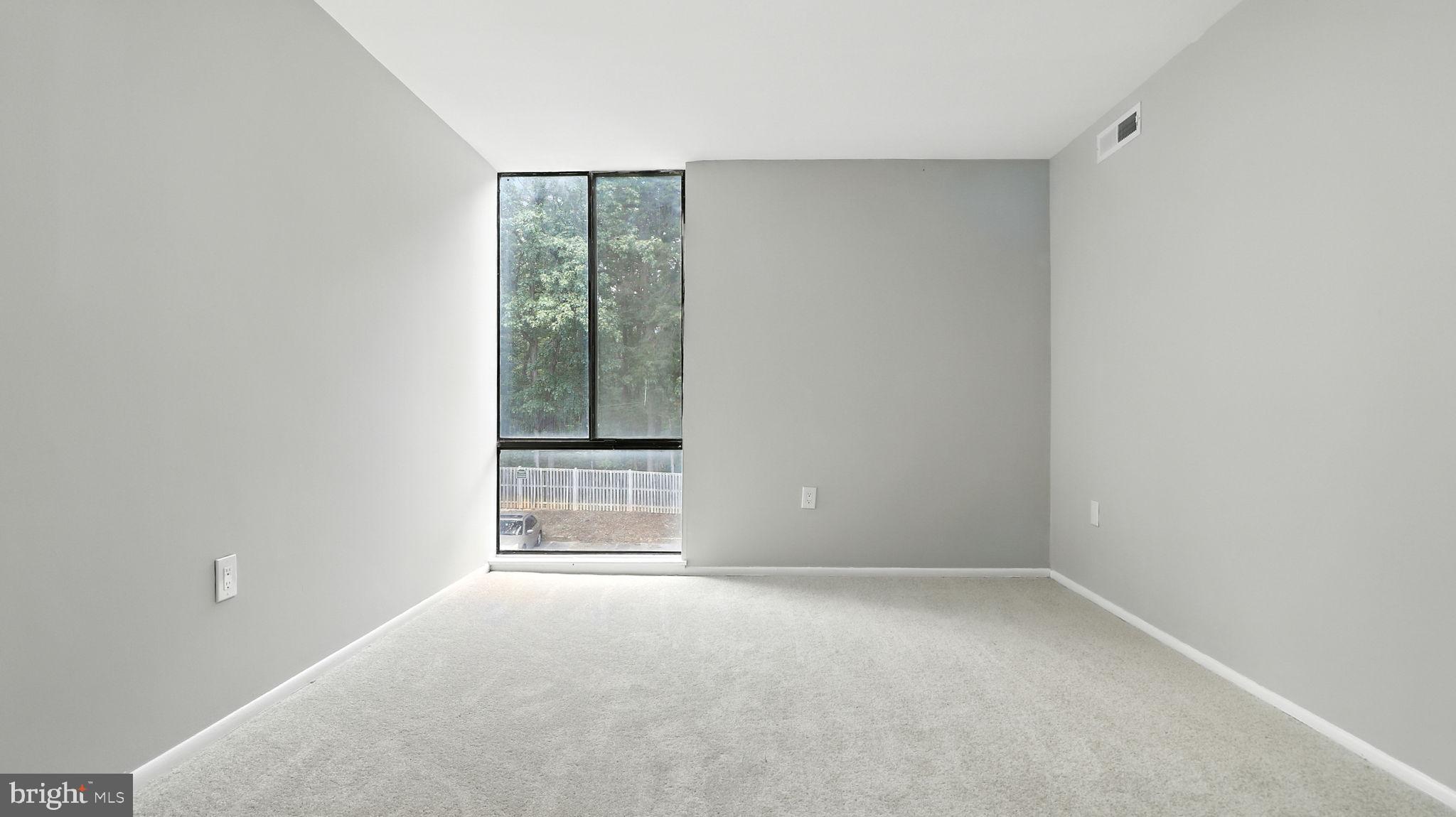 8693 Greenbelt Road, Unit 202 Greenbelt, MD 20770 - Photo 31 of 40 a view of an empty room with a window