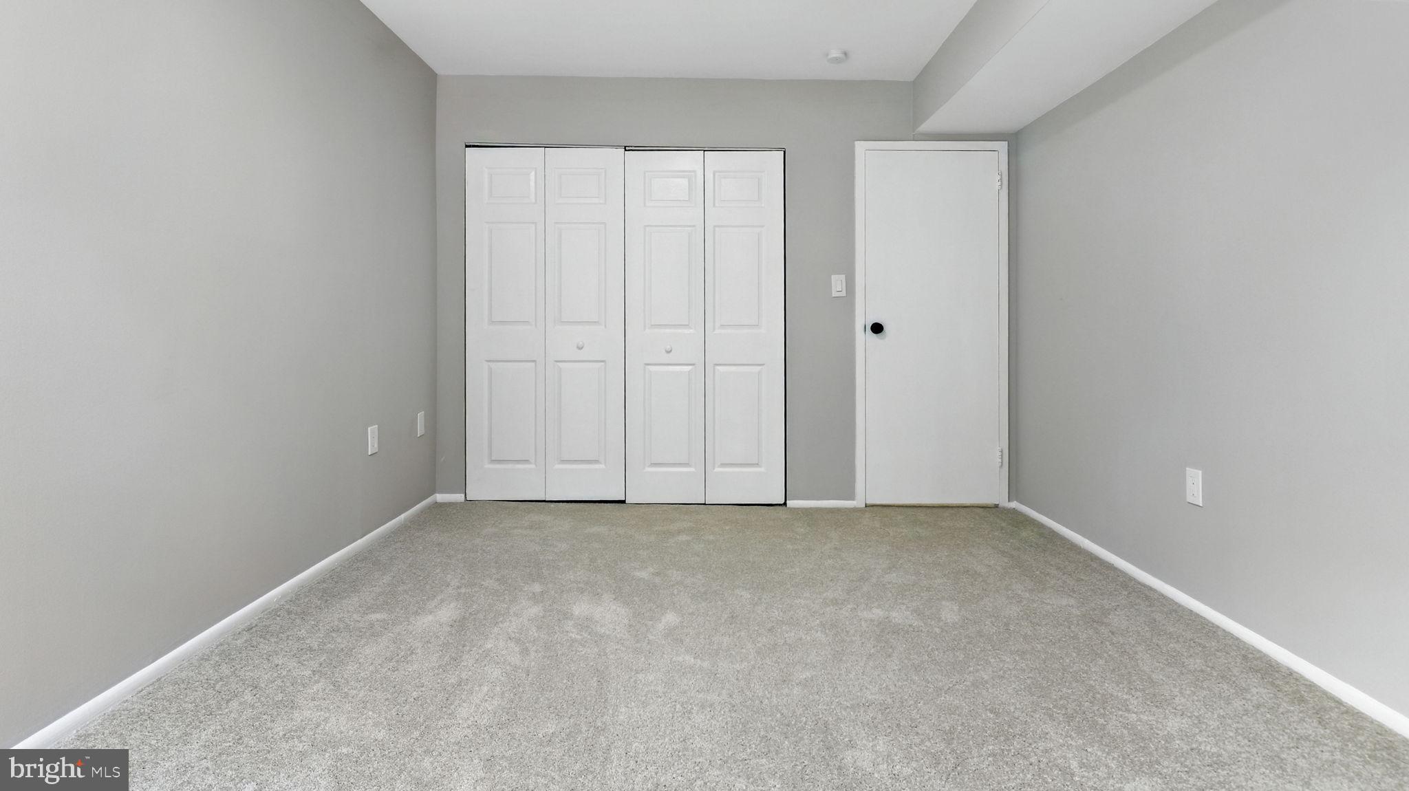 8693 Greenbelt Road, Unit 202 Greenbelt, MD 20770 - Photo 39 of 40 a view of an empty room with closet area