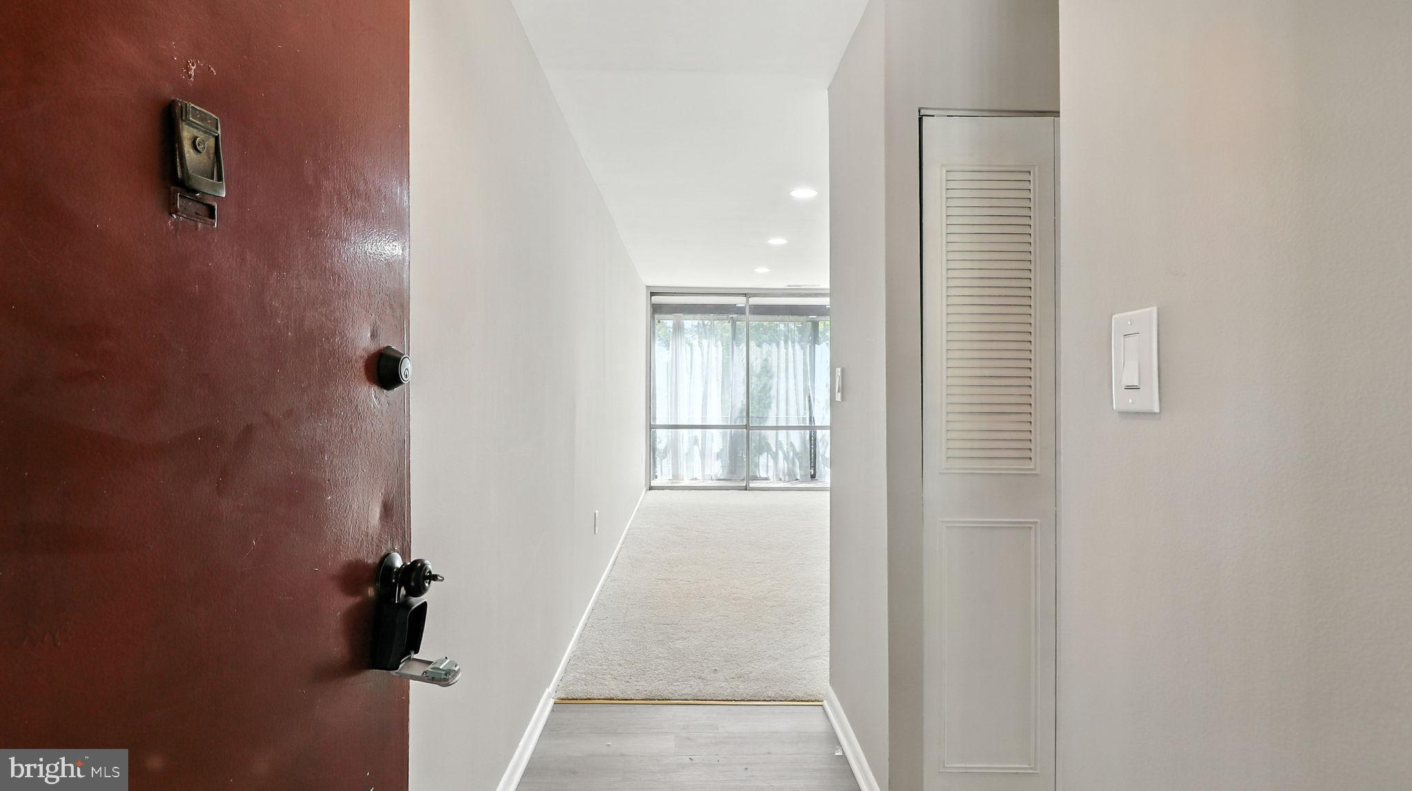 8693 Greenbelt Road, Unit 202 Greenbelt, MD 20770 - Photo 6 of 40 a view of hallway with stairs