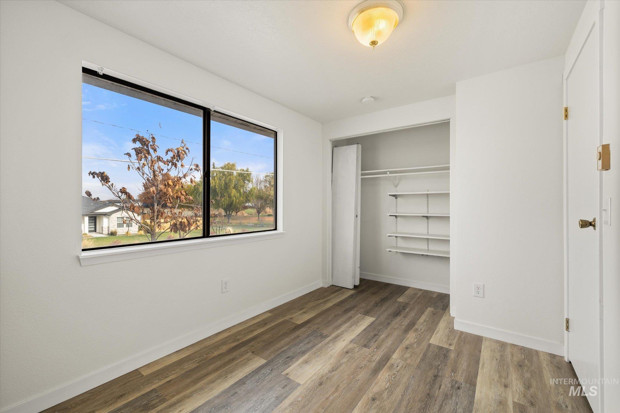419 West Logan Street Caldwell, ID 83605 - Photo 30 of 50 Unfurnished bedroom with a closet and light wood-style flooring