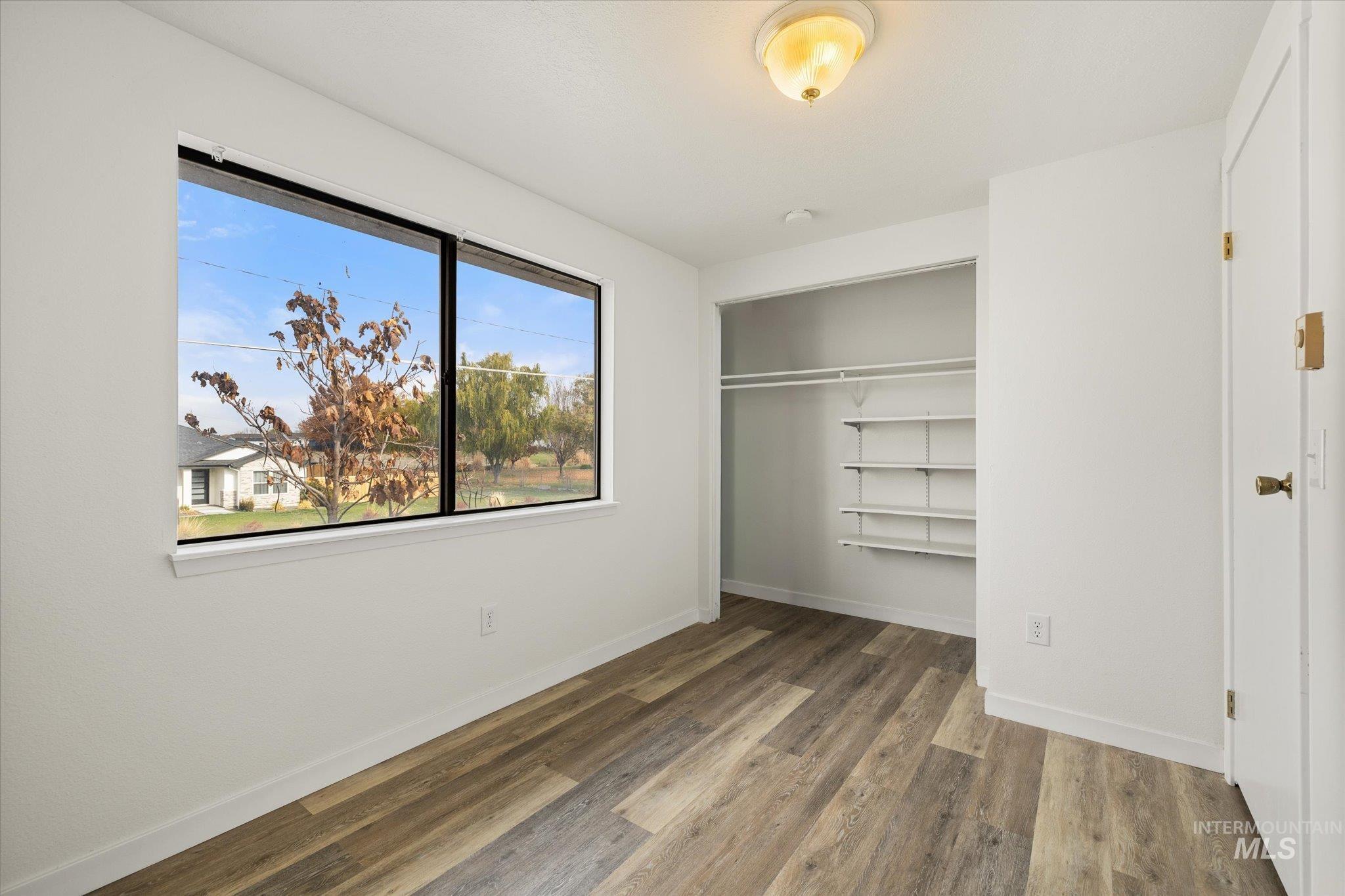 419 West Logan Street Caldwell, ID 83605 - Photo 31 of 50 Unfurnished bedroom with a closet and light wood finished floors