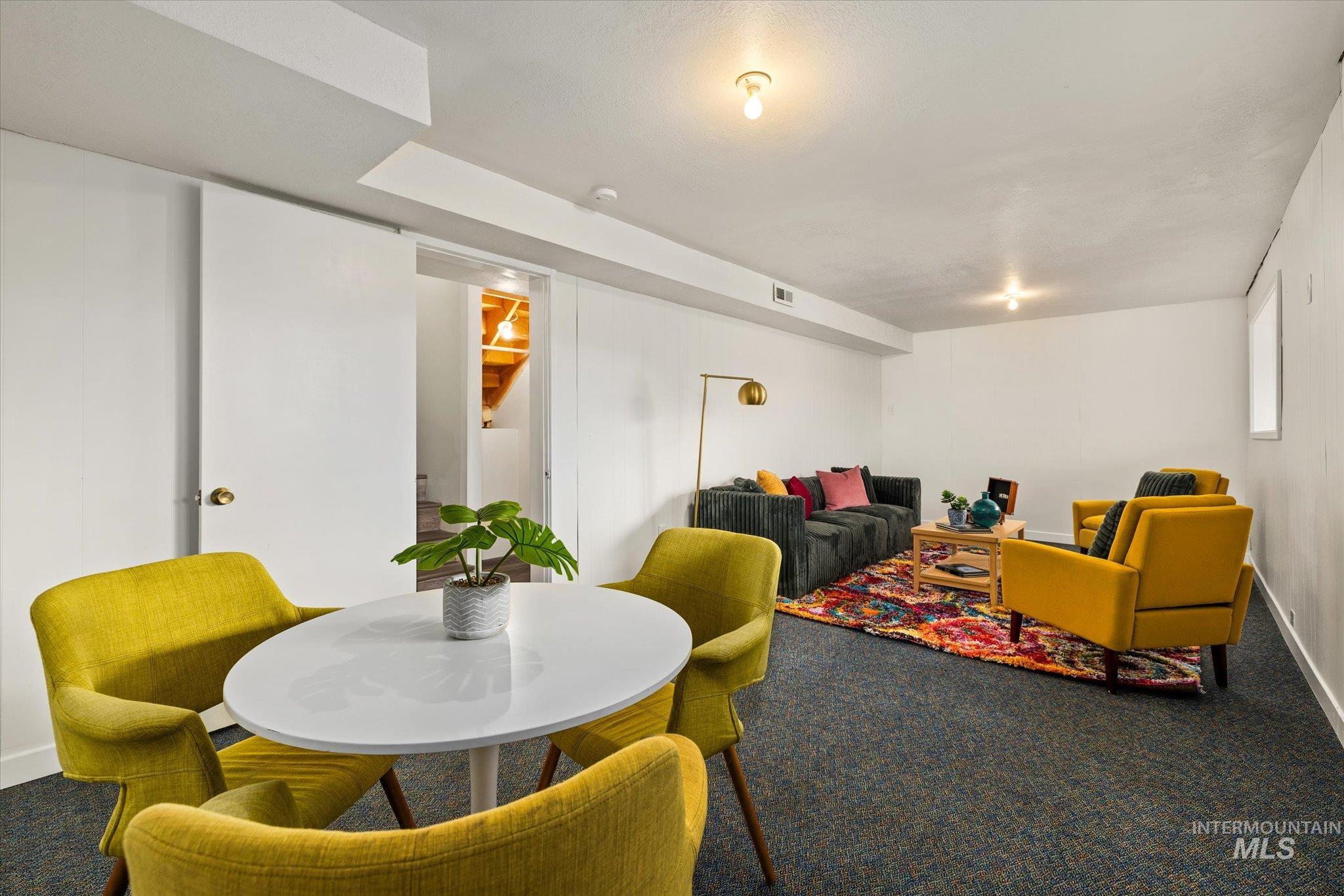 419 West Logan Street Caldwell, ID 83605 - Photo 37 of 50 Carpeted dining space with baseboards