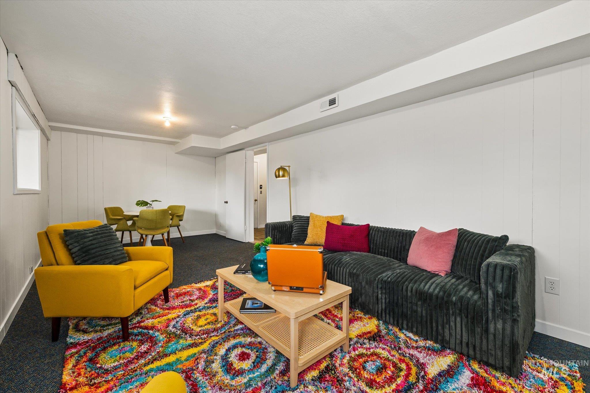 419 West Logan Street Caldwell, ID 83605 - Photo 42 of 50 Living area with carpet floors and wooden walls