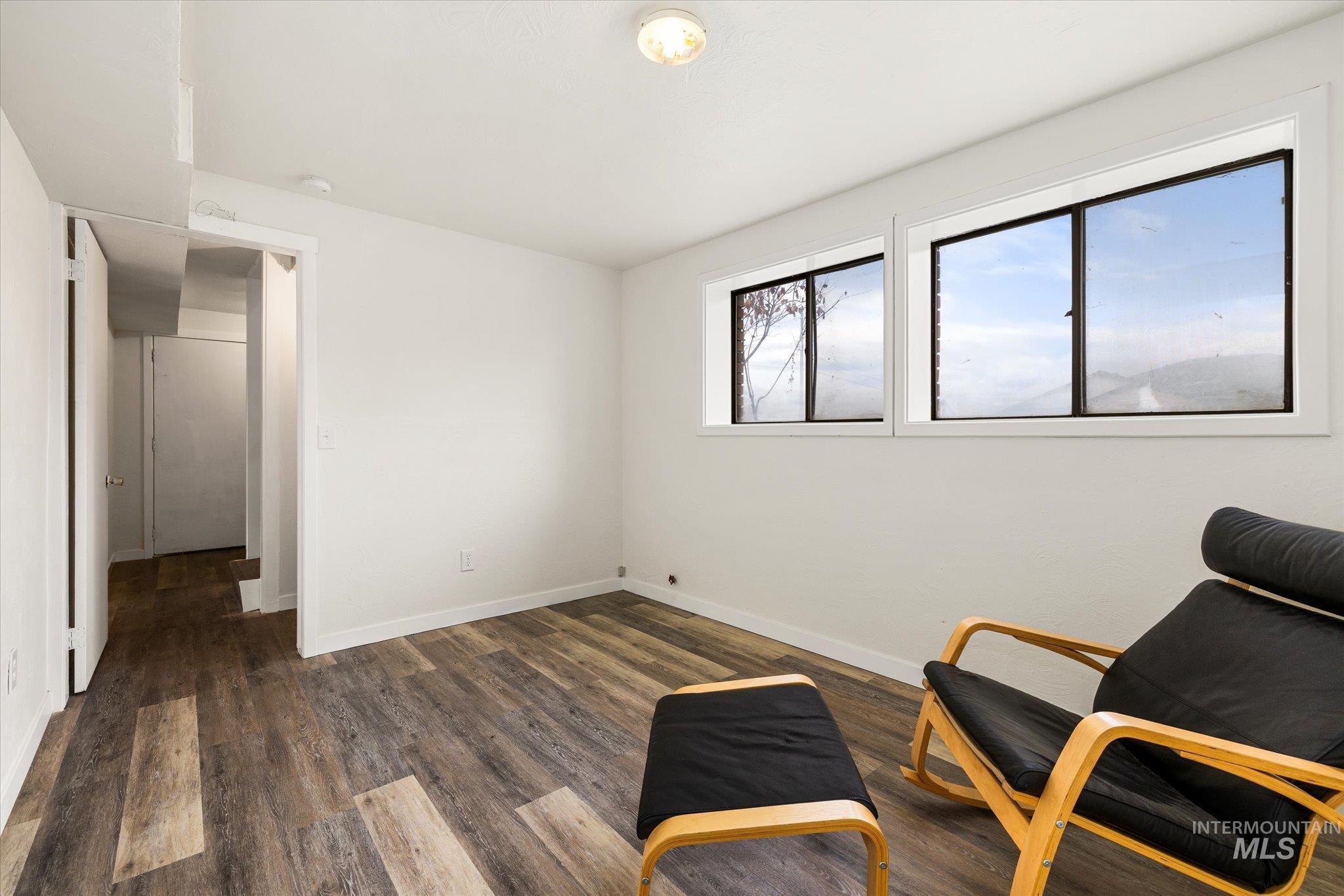 419 West Logan Street Caldwell, ID 83605 - Photo 43 of 50 Sitting room featuring dark wood finished floors and baseboards