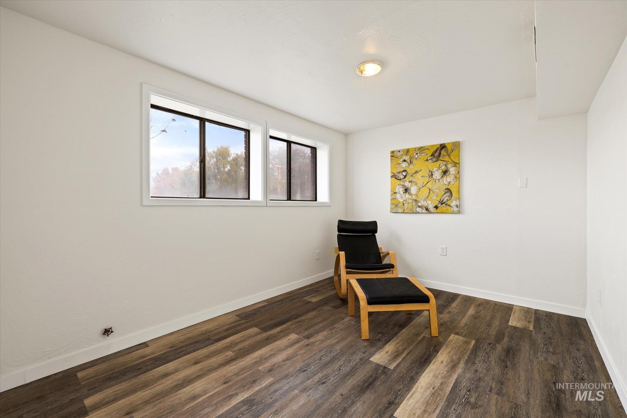 419 West Logan Street Caldwell, ID 83605 - Photo 44 of 50 Unfurnished room with dark wood-style flooring