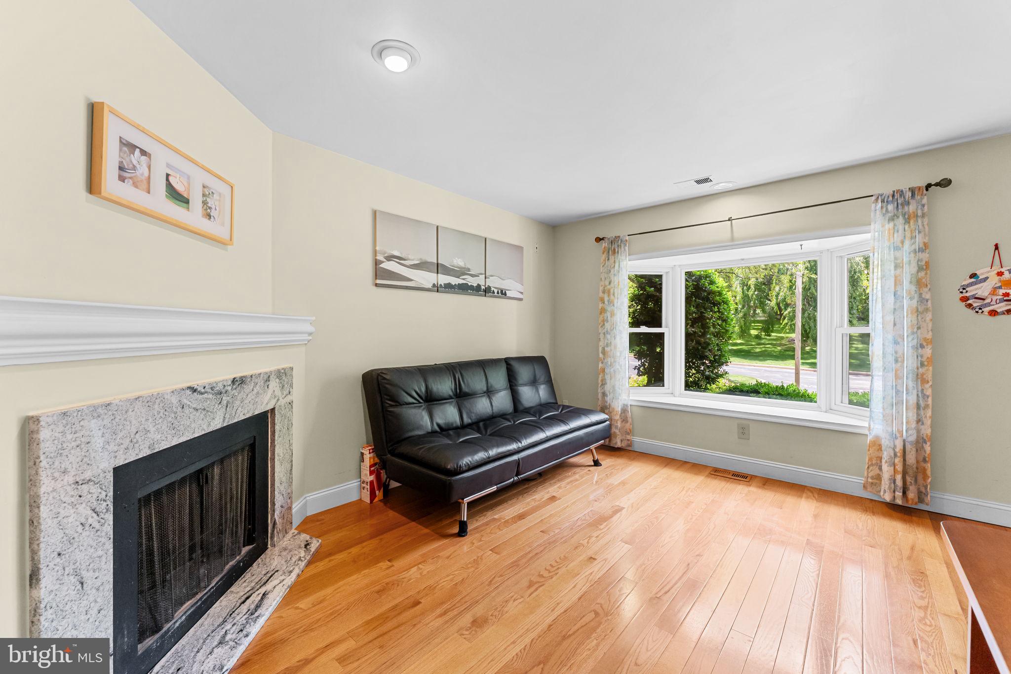 14 Elan Lane Chesterbrook, PA 19087 - Photo 3 of 31 Bright and inviting living room with fireplace