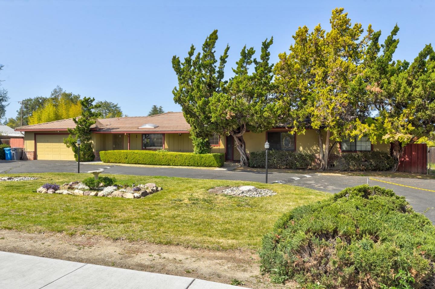 20865 McClellan Road Cupertino, CA 95014 - Photo 2 of 13 a front view of a house with a garden