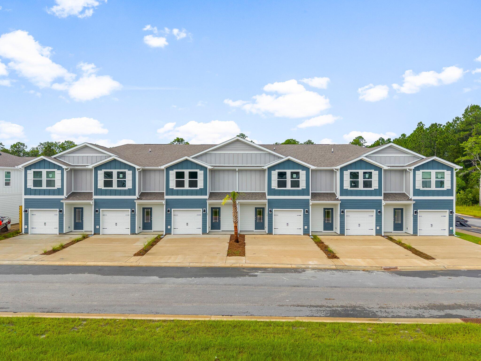44 Hawk Street Santa Rosa Beach, FL 32459 - Photo 2 of 34 a front view of a house with a yard