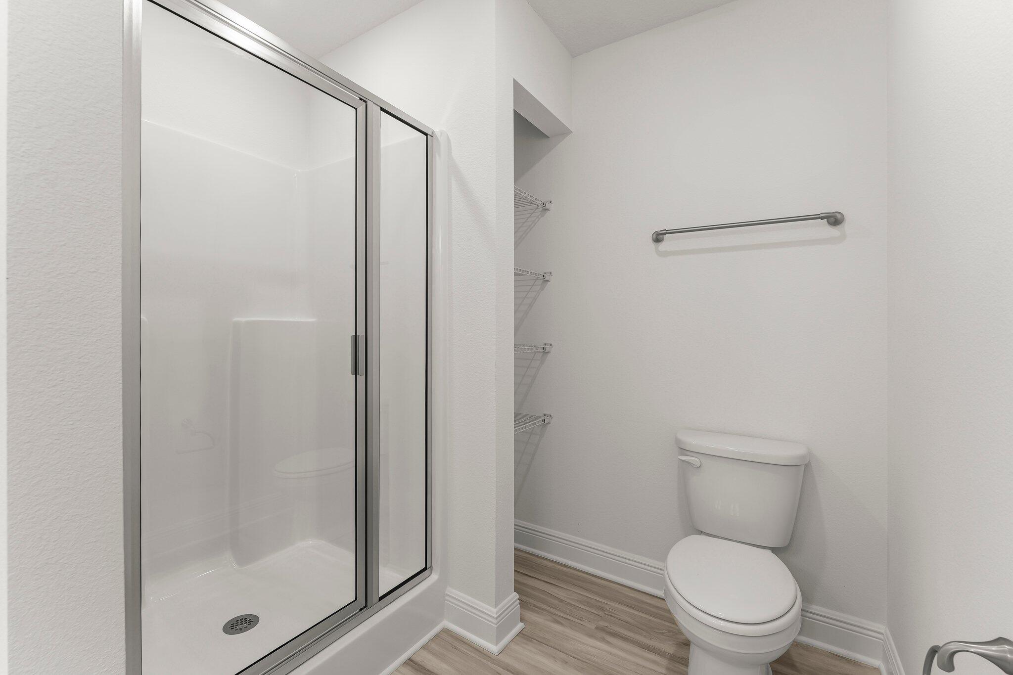 44 Hawk Street Santa Rosa Beach, FL 32459 - Photo 24 of 34 a white toilet sitting next to a bathroom sink