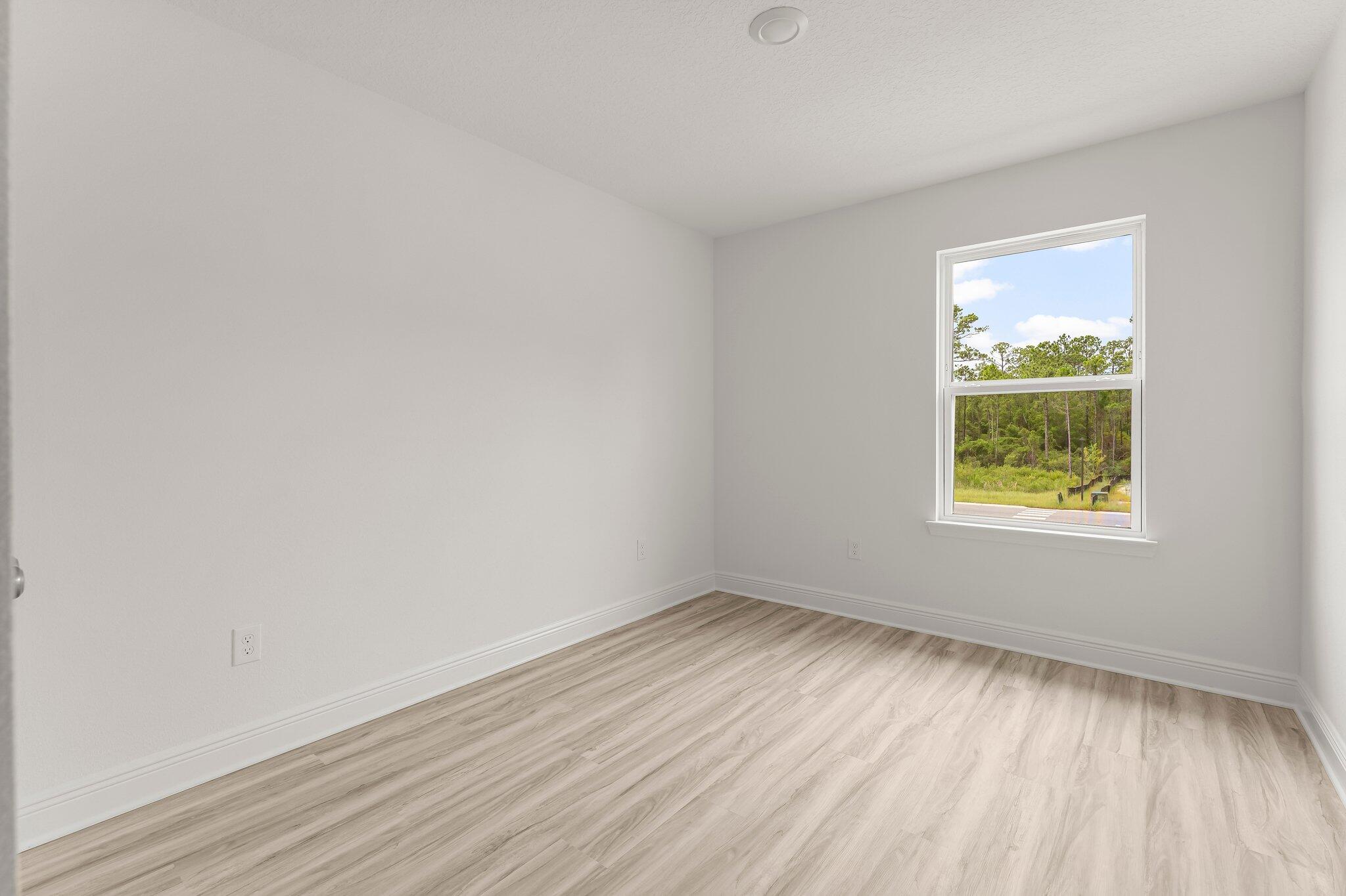 44 Hawk Street Santa Rosa Beach, FL 32459 - Photo 28 of 34 wooden floor in an empty room with a window