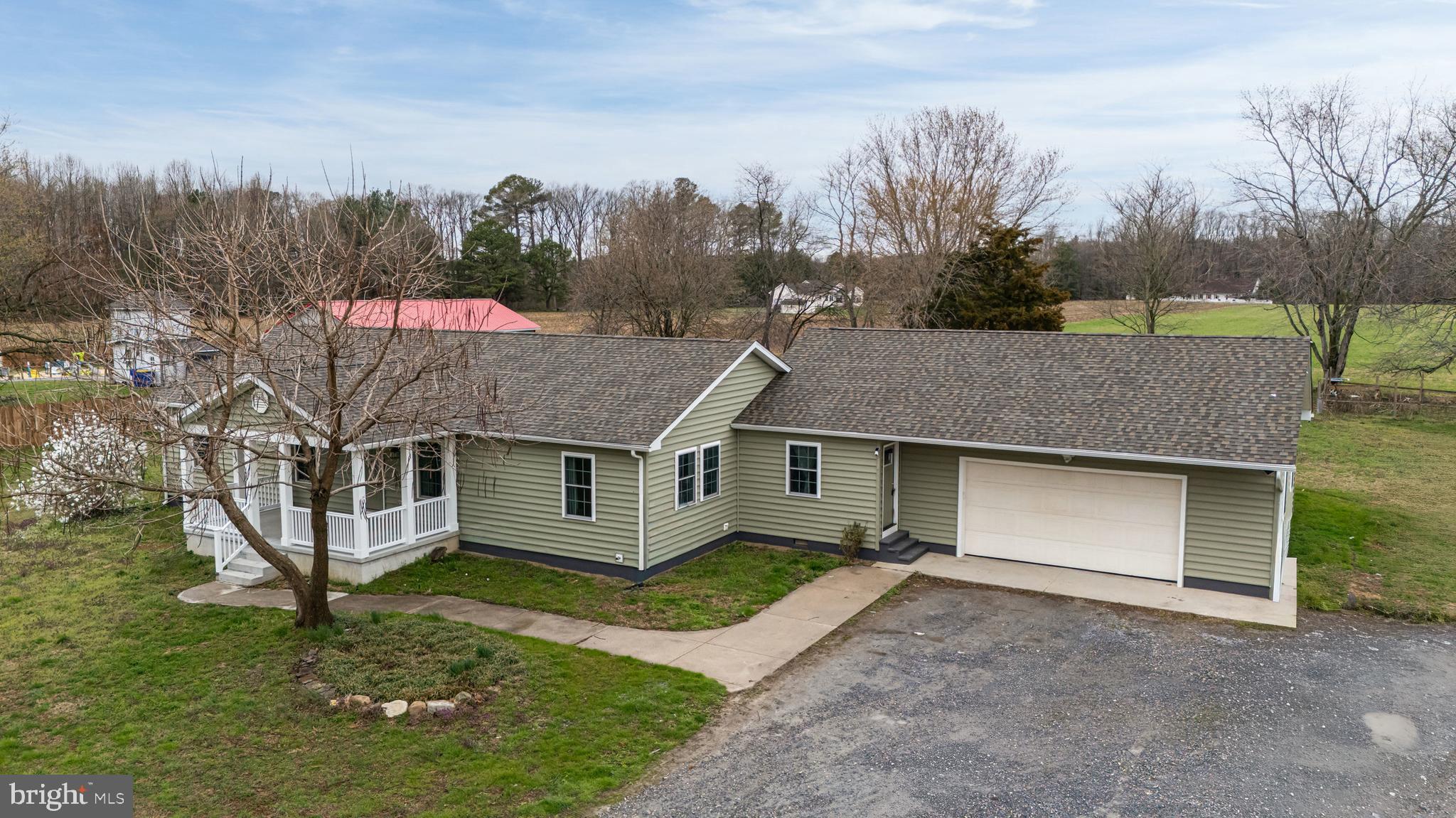 1231 Walnut Shade Road Dover, DE 19901 - Photo 6 of 32 a view of a house with a yard and tree s