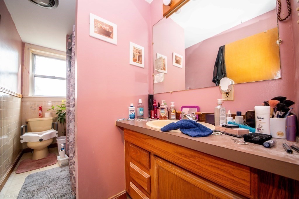 119 Lapham Street Fall River, MA 02721 - Photo 20 of 29 a bathroom with a sink vanity and a toilet