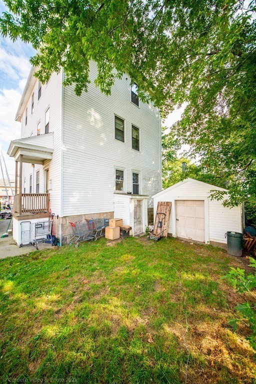 119 Lapham Street Fall River, MA 02721 - Photo 2 of 29 a house view with a sitting space and garden