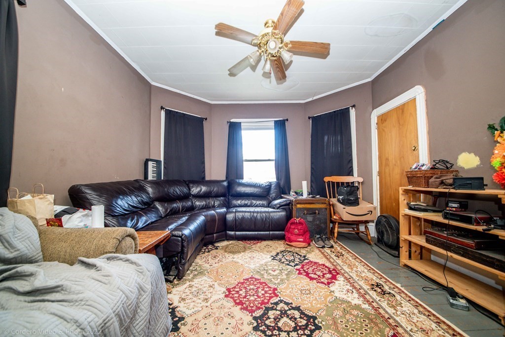 119 Lapham Street Fall River, MA 02721 - Photo 27 of 29 a living room with furniture and a couch