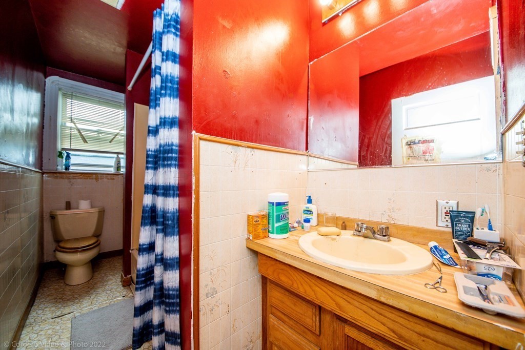 119 Lapham Street Fall River, MA 02721 - Photo 29 of 29 a bathroom with a sink and a mirror