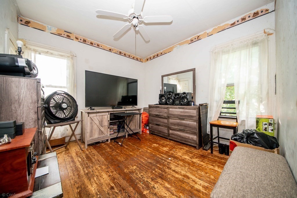 119 Lapham Street Fall River, MA 02721 - Photo 6 of 29 a living room with furniture and a flat screen tv