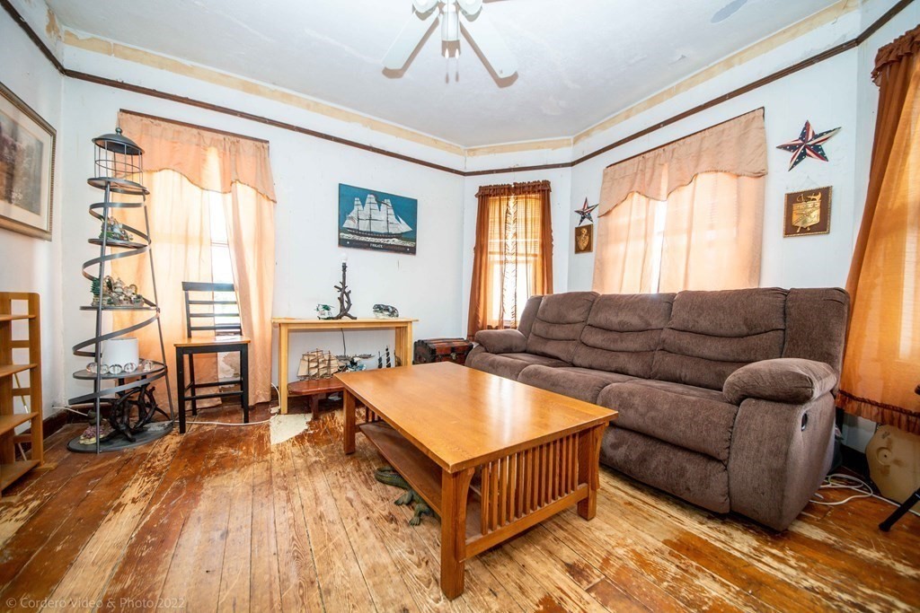 119 Lapham Street Fall River, MA 02721 - Photo 9 of 29 a living room with furniture and a large window