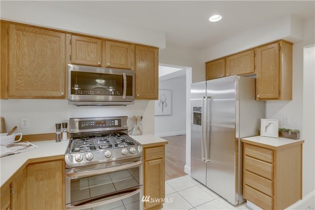 a kitchen with a stove microwave and refrigerator
