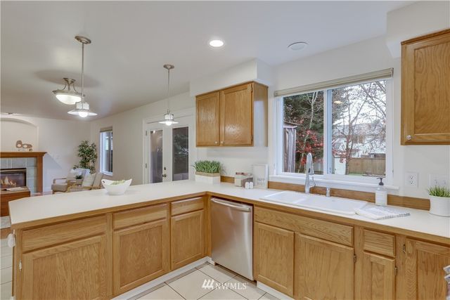 a kitchen with sink and window
