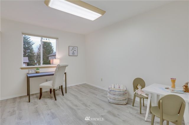 a room with a table and chairs