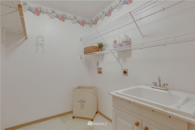 a bathroom with a sink and cabinets