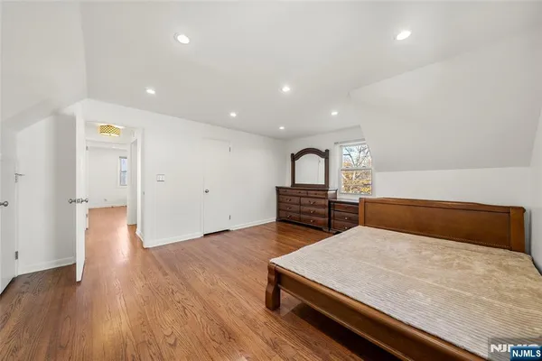 a room with a bed and a view of bathroom